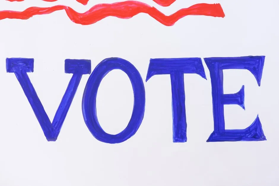 Close-up of a blue 'VOTE' sign with red stripes, emphasizing voter participation.