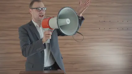 Horizontal video: Political candidate speaking through megaphone 8847402. Duration: 19 seconds. Resolution: 1920x1080