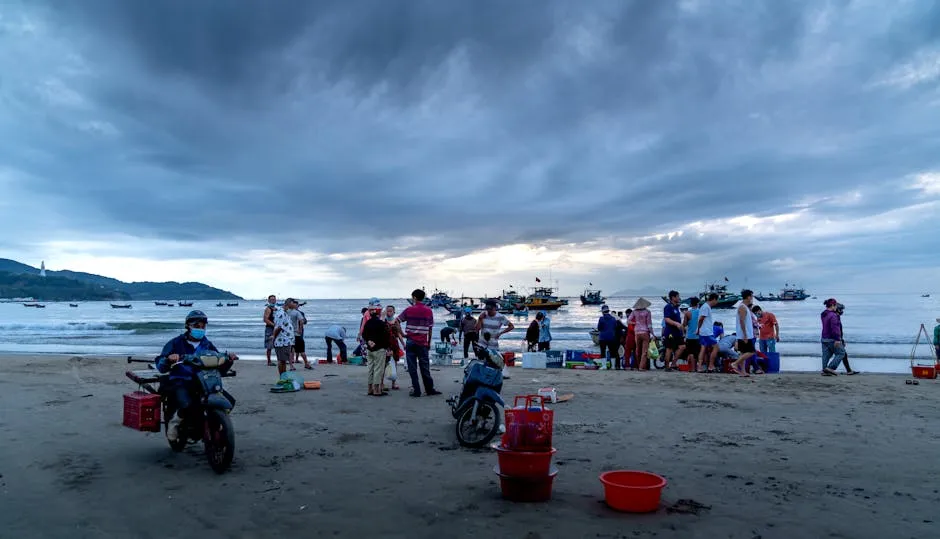 People with Fishing Containers on Sea Beach at Dawn