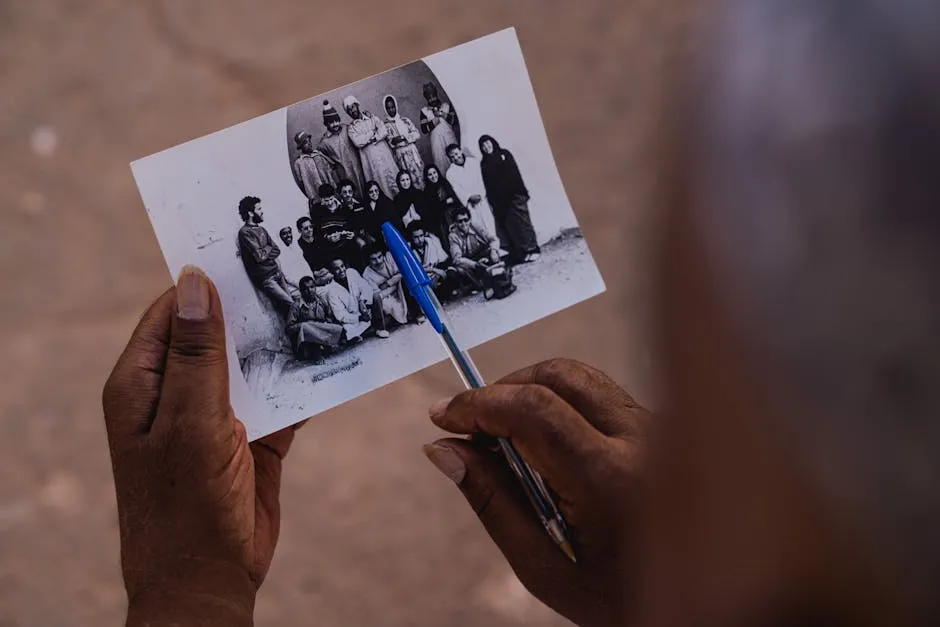 Elderly Person Hand Holding Vintage Photograph