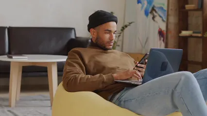 Horizontal video: Man smartphone desk laptop 5527603. Duration: 25 seconds. Resolution: 3840x2160