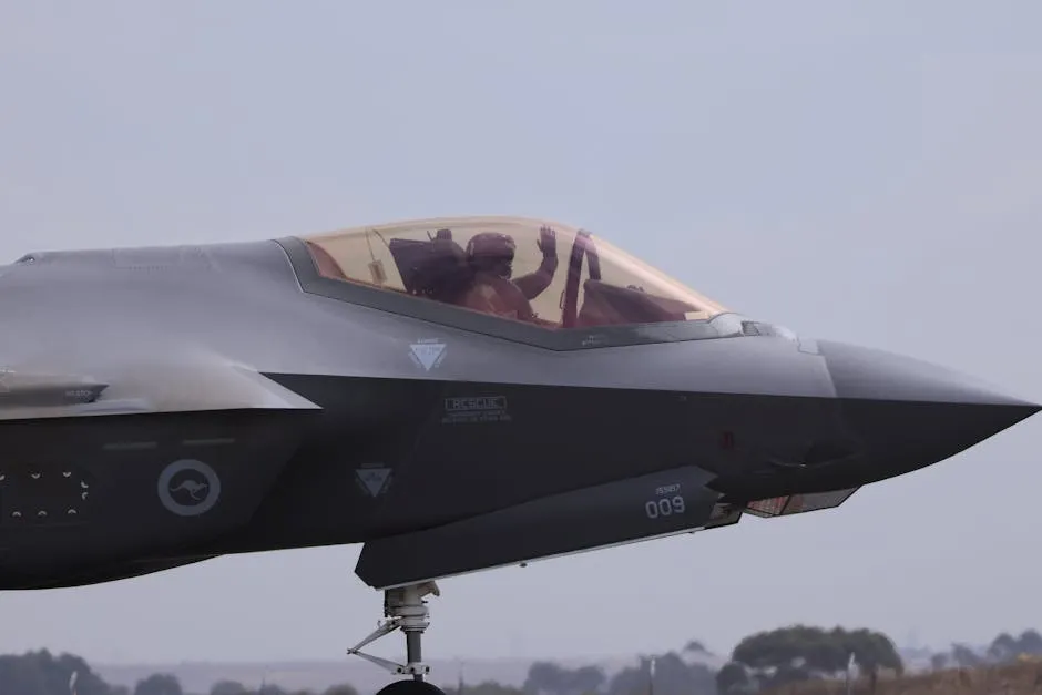 Close-up of an F-35 fighter jet with a pilot waving, captured at Geelong, VIC.