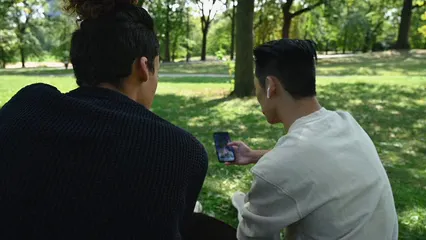 Horizontal video: Two men looking at a smartphone 5552310. Duration: 10 seconds. Resolution: 3840x2160