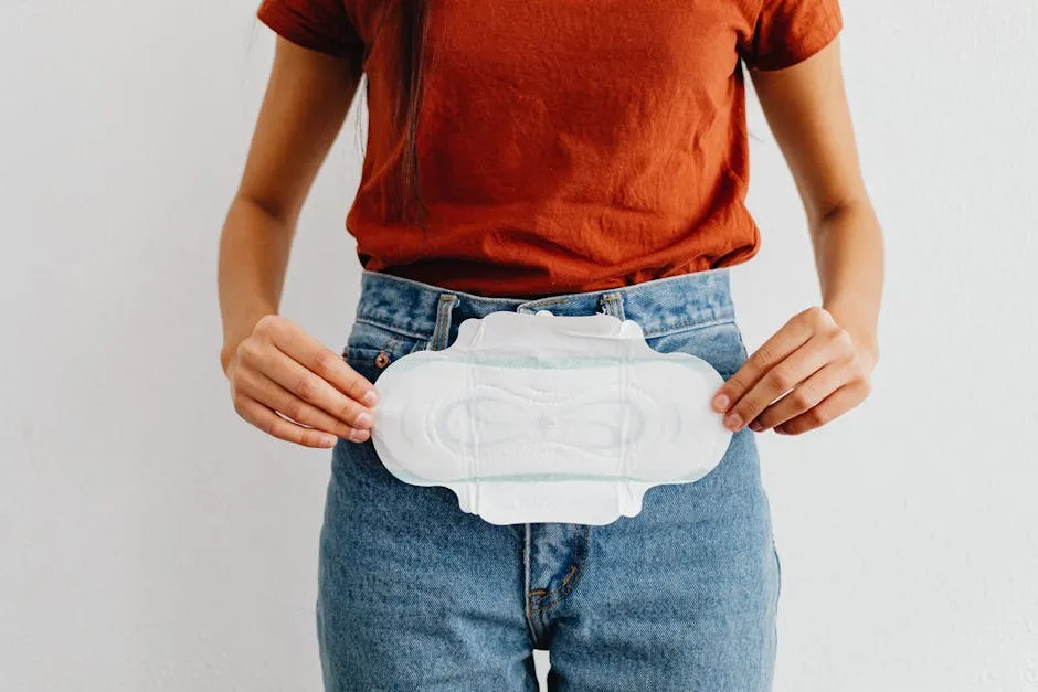 A woman showing a sanitary pad, highlighting menstrual health and hygiene.