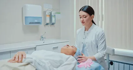Horizontal video: Woman putting on gloves while talking to a patient 7581439. Duration: 26 seconds. Resolution: 4096x2160