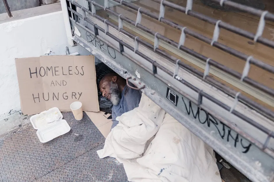 A Homeless Man Lying on the Ground