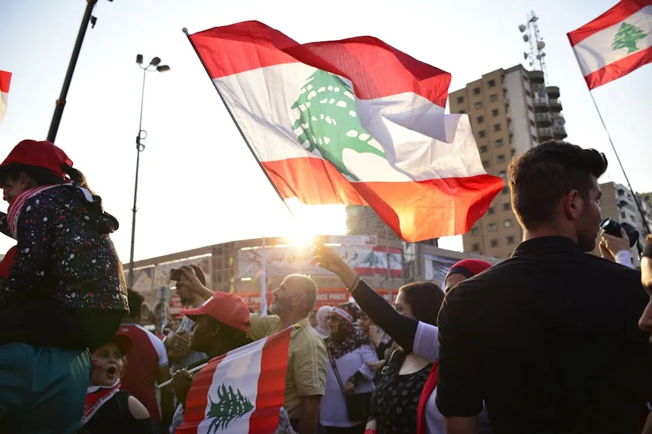 A vibrant rally in Tripoli, Lebanon, showcasing patriotism with waving national flags at sunset.