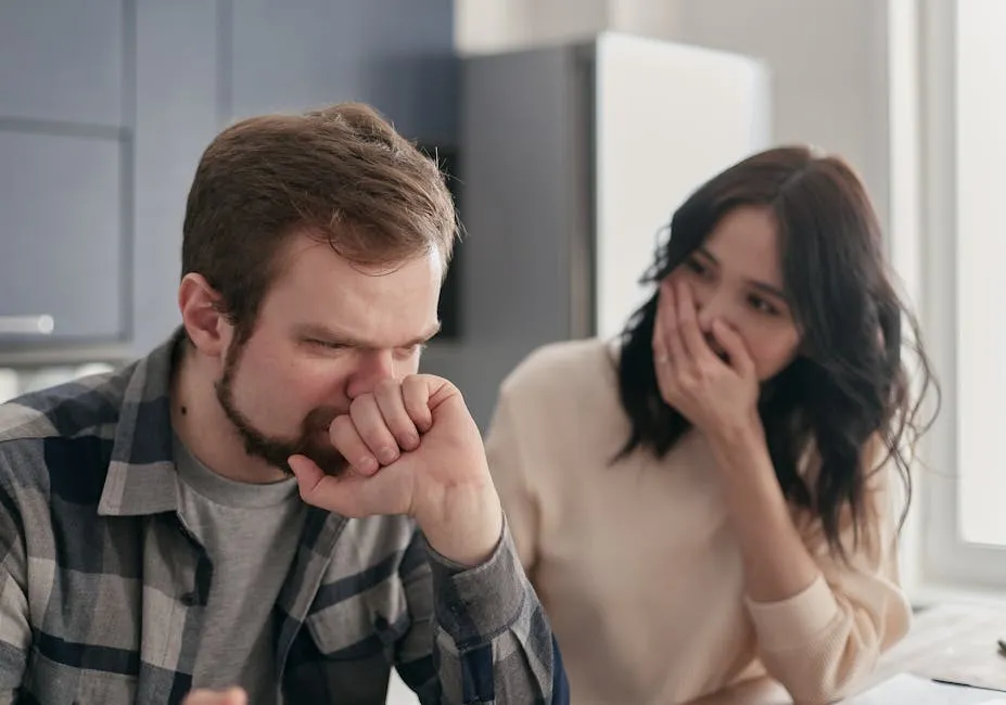 A couple looks anxious and distressed while having a serious conversation indoors.