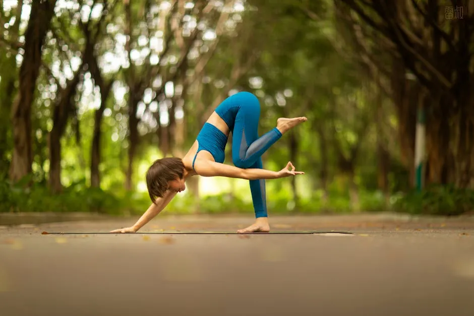A woman in sportswear performing yoga on a mat in a serene park environment.