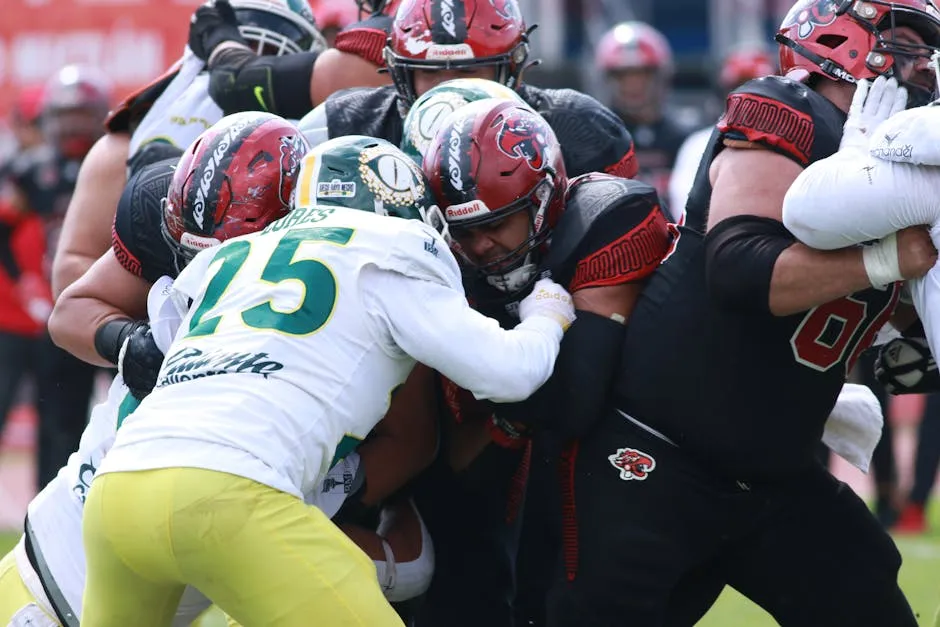 Players clash in an intense American football game, showcasing teamwork and athleticism.